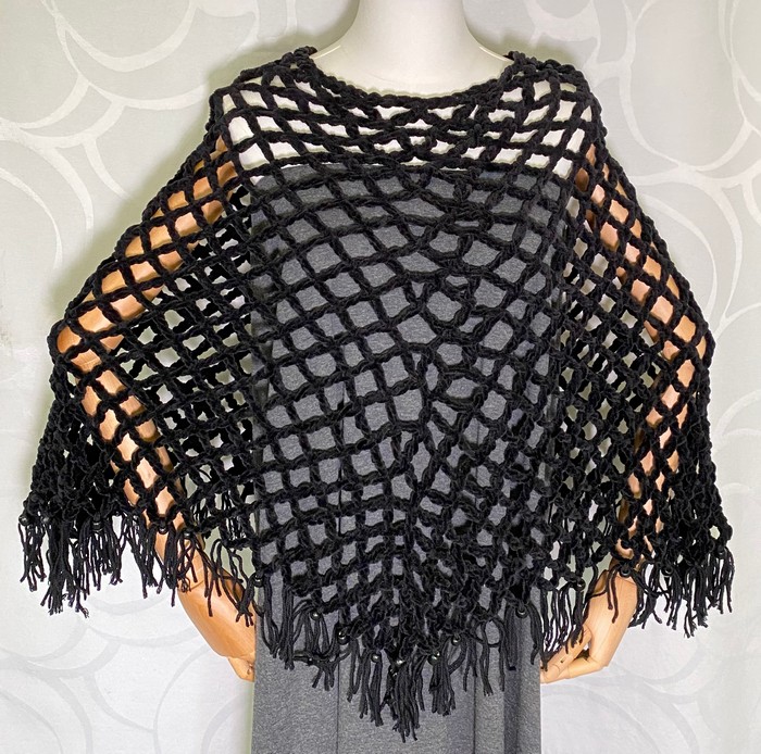 Käsintehty poncho